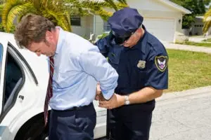 businessman being arrested