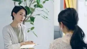 Asian mental health lawyer working with patient