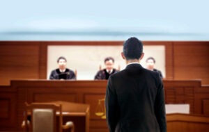 man appearing before a court to be judged