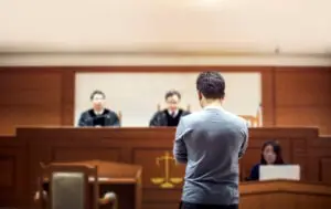 man defending himself in court