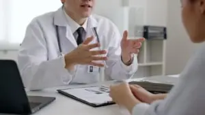 woman talking to doctor about her loved one