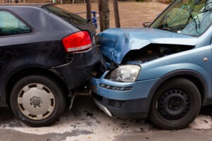 blue and black cars in a crash