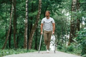 young man on crutches