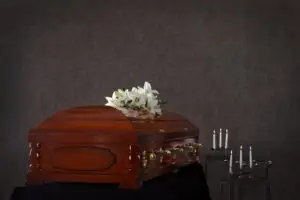 casket with white lilies