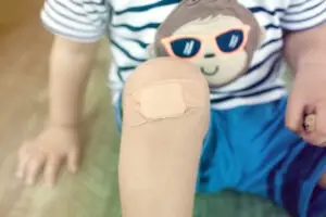 child with bandaged knee