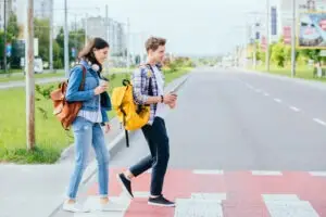 teenagers crossing the street