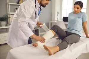 woman getting bandaged at hospital