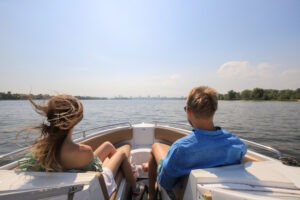 young couple boating on motor boat