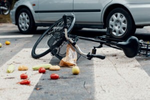 bike with spilled fruit in the road