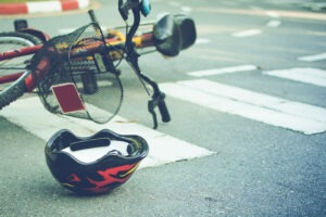 helmet and bike in road