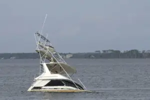 large cabin cruiser fishing boat sits in water