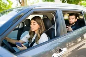 rideshare driver and passenger both texting