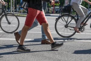 walkers next to bikers on the road