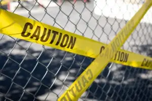 caution tape on chainlink fence