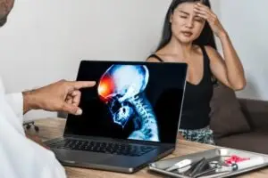 doctor showing x-ray pain brain