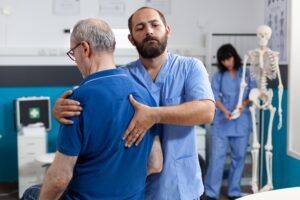 orthopedic nurse stretching spinal cord