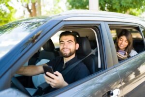 happy uber driver with passenger