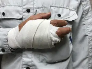 male worker with injured hand
