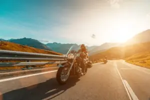 motorcycle rider driving at dusk
