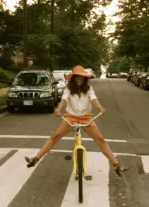 woman biking with spread legs