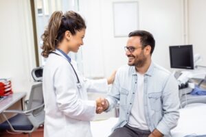 burn victim shaking hands with doctor