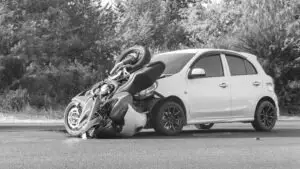 motorcycle-crashed-into-white-car