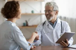 patient smiling with doctor