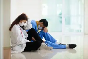 tired doctors in hallway
