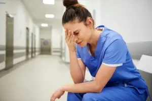 female nurse suffering a headache