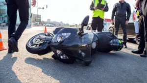 The photo shows a motorcycle accident scene. Contact a Lynwood motorcycle accident lawyer now.