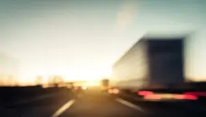 A blurry truck. You can discuss your legal options with a Palmdale truck accident lawyer after a wreck.