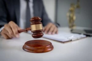 A judge lowering a gavel when determining the difference between murder and manslaughter.