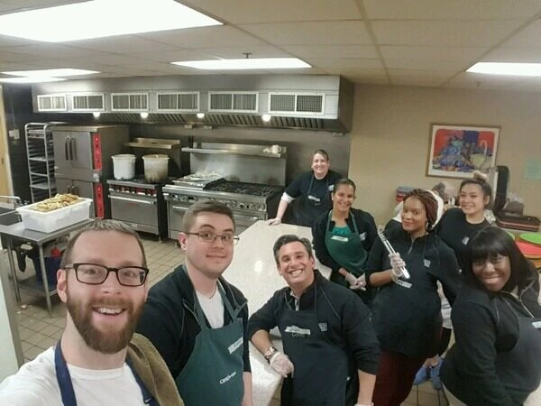 Jason Stone and team in a kitchen, part of the 'Providing a Helping Hand' campaign.