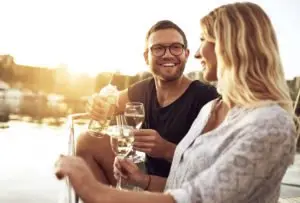 A couple drinking wine on a boat