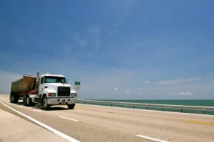 A hauler truck crossing a Florida bridge.