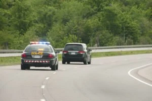 Police attempting to pull over a minivan.