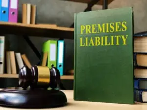 A premises liability lawbook stands next to a gavel.