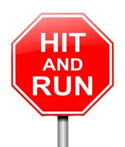 A stop sign with the words “Hit and Run” on it