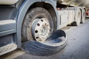 A blown-out tire on a truck.