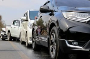 Multiple vehicles parked after an auto accident.