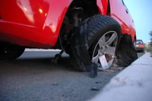 broken tire on a red car