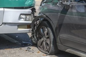 bus hitting a passenger car from behind