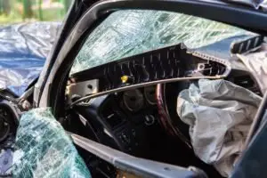 car with broken window after bad accident