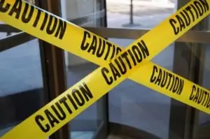 caution tape over an exit