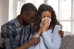 grieving black couple