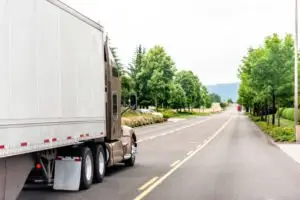 moving truck driving down the road