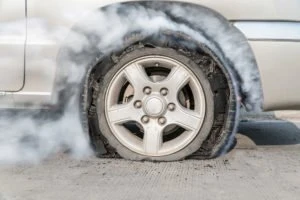 smoking blown-out tire