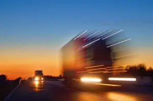 speeding truck at dusk