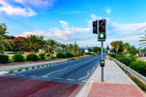 A traffic signal on the side of the road.