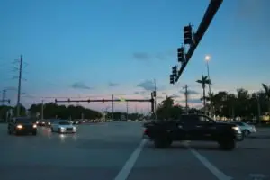 Vehicles making a turn at a Florida intersection.